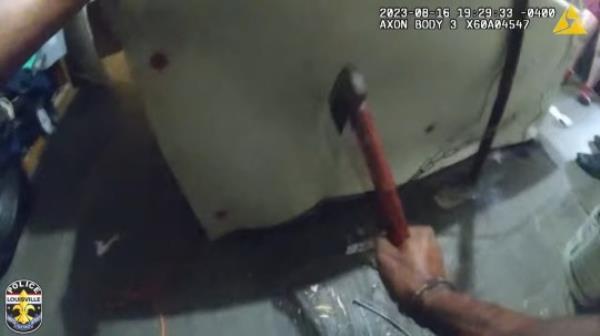 Moises May Newly released body camera video captured the dramatic rescue of a woman who was left chained to the floor of a Kentucky home for two days. Louisville Metro police officers climbed through the second-floor window of a decrepit home last Wednesday night after neighbors reported hearing the distressed screams for help. The officers tried to break into the building by kicking down doors and windows o<em></em>nly to find the home completely barricaded, the LMPD said Tuesday.