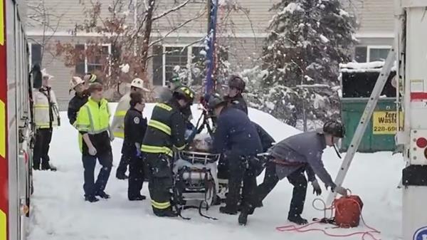 Firefighters attending to the woman. 