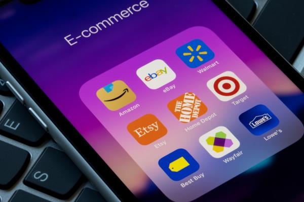 Assorted retail e-commerce mobile apps are seen on an iPhone, including Amazon, eBay, Walmart, Etsy, the Home Depot, Target, Best Buy, Wayfair, and Lowe's.