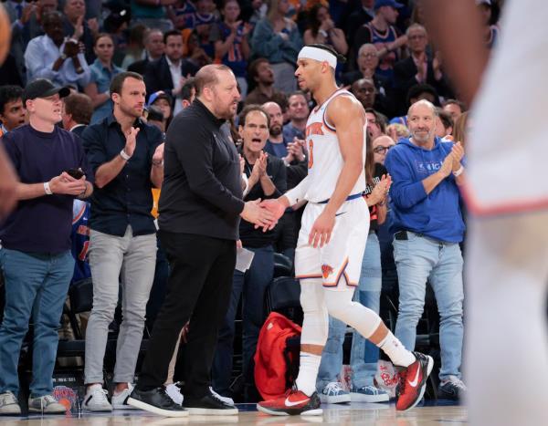 Josh Hart #3 is greeted by New York Knicks head coach Tom Thibodeau  as he walks back to the bench to a stand ovation after he fouls out during the fourth quarter.