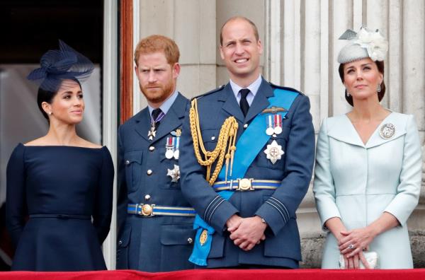 Members of the Royal Family including Prince William, Prince Harry, and Meghan, Duchess of Sussex, watching a flypast from the balcony of Buckingham Palace to mark the centenary of the RAF.