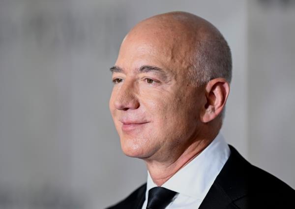 Amazon shareholders are suing the e-commerce giant for allegedly refusing to co<em></em>nsider Elon Musk's SpaceX for a valuable satellite co<em></em>ntract due to his o<em></em>ngoing feud with company founder Jeff Bezos (pictured).