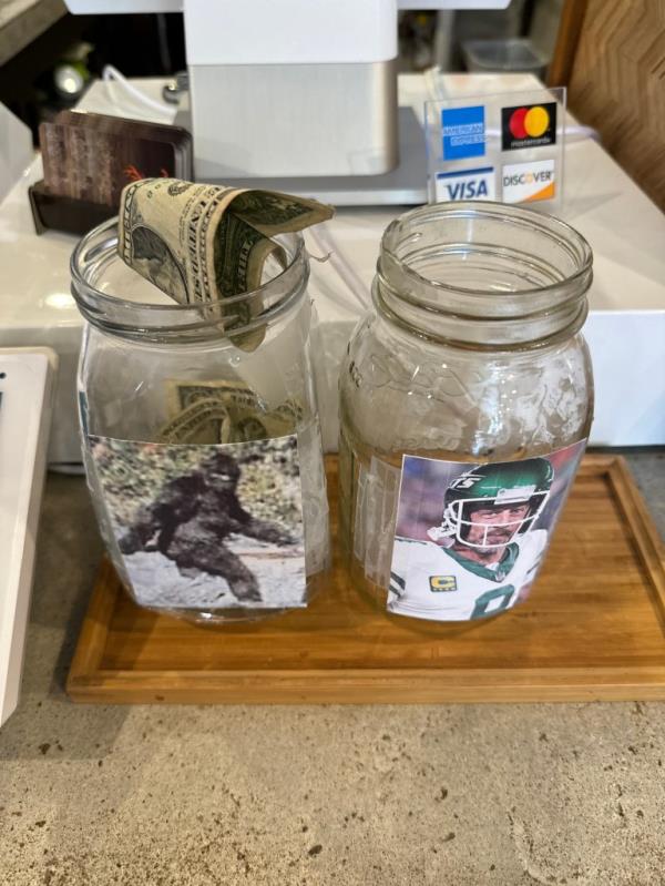 the two tip jars on a counter