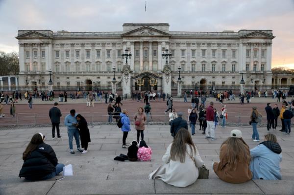 People gather outside Buckingham Palace in London,