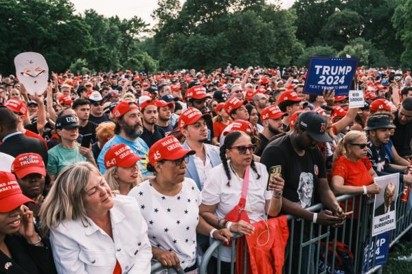 People attend a campaign rally for former US president Do<em></em>nald Trump in Crotona Park in the Bronx.