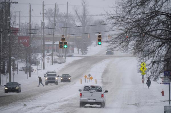 People and traffic are sparse on Rosa L. Parks Blvd. after a winter storm in Nashville, Tenn., Monday, Jan. 15, 2024