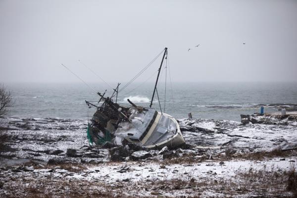 A fishing boat that had run aground at Trundy Beach on Saturday morning, Jan. 13, 2024, in Cape Elizabeth, Maine. 