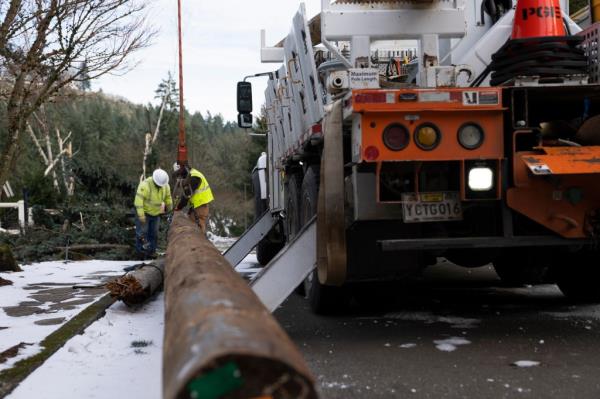 - Workers from PGE (Portland General Electric) work on restoring power to the area after a storm on Tuesday, Jan. 16, 2024