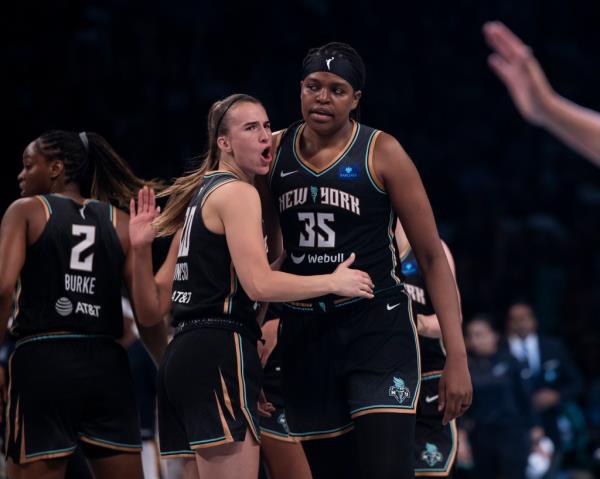 Sabrina Io<em></em>nescu and Jo<em></em>nquel Jo<em></em>nes react the during their home opener vs Indiana Fever at Barclays Center.