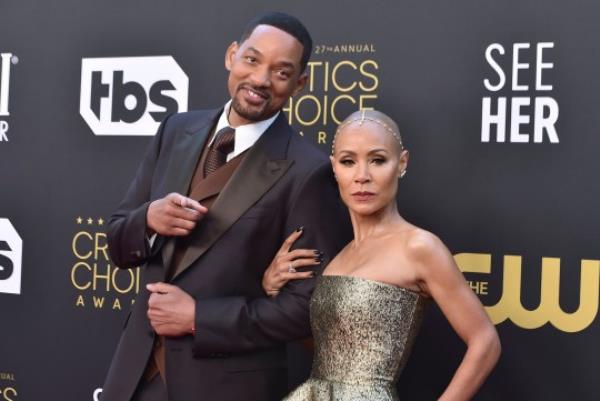 FILE - Will Smith, left, and Jada Pinkett Smith arrive at the 27th annual Critics Choice Awards in Los Angeles on March 13, 2022. Pinkett Smith and husband Will Smith have lived what she says are ?completely separate lives? since 2016. Pinkett Smith made the revelation in an interview with Hoda Kotb. The prominent Hollywood couple married in 1997 and have addressed separations and marital troubles. But never this specifically. (Photo by Jordan Strauss/Invision/AP, File)