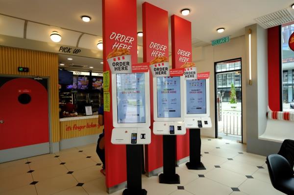 Ghai said the self-serve kiosks will help him cut down on labor costs while allowing him to refrain from raising menu prices. The image above shows a self-serve kiosk at a Kentucky Fried Chicken in Malaysia.