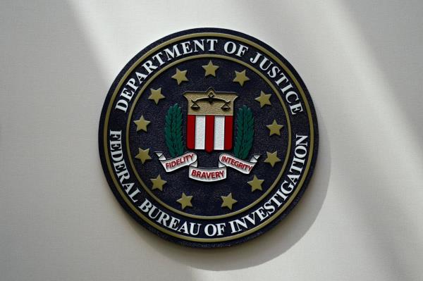 FBI seal on a wall in Omaha, Neb with information a<em></em>bout fraud against older Americans