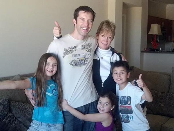 Christine is pictured with Daniel Halseth and his children.