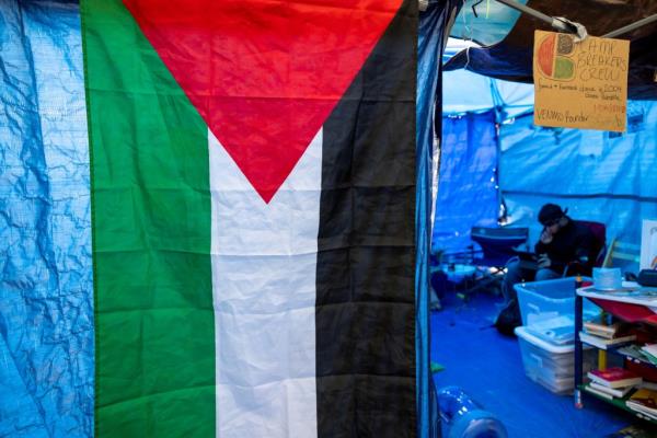 A Palestinian flag is seen above at a tent encampment on the Auraria Campus in Denver.