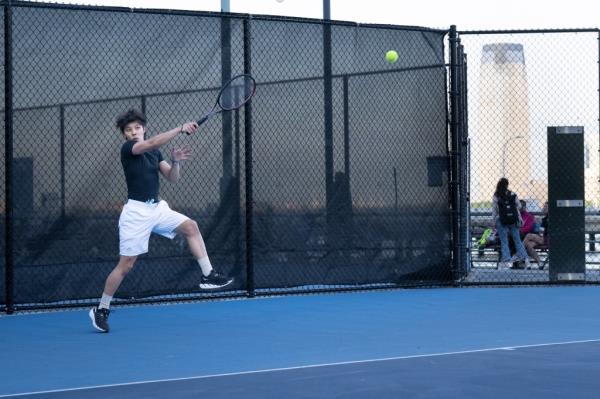 Yuki Tsutsumi playing tennis at Hudson River Park in the early morning