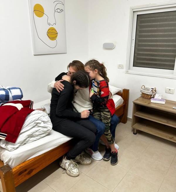 Maayan Zin hugged her two daughters, Dafna Elyakim, 15, and 8-year-old Ela Elyakim after they were released by Hamas on Sunday.