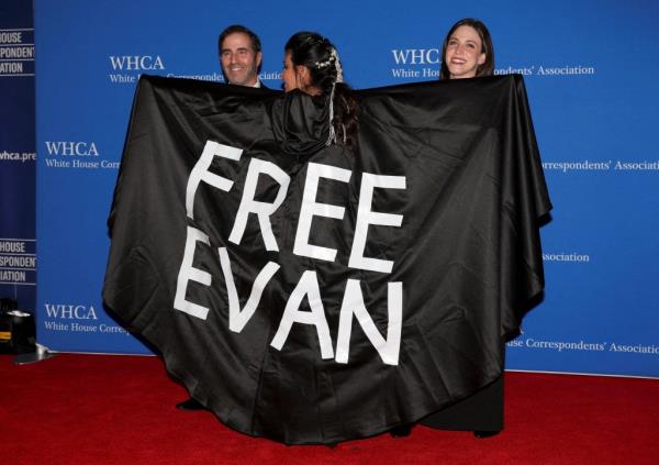 Washington Post reporter displaying a cape with a 