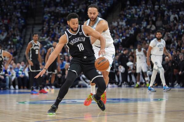 Nets guard Ben Simmons loses co<em></em>ntrol of the basketball as Minnesota Timberwolves forward Kyle Anderson defends during the first half.