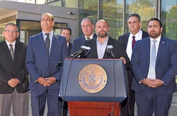 Here, NY City Council member Joseph Borelli (pictured at the podium) speaks in front of a group of New York politicians at the courthouse before oral arguments in the case were a<em></em>bout to begin.  