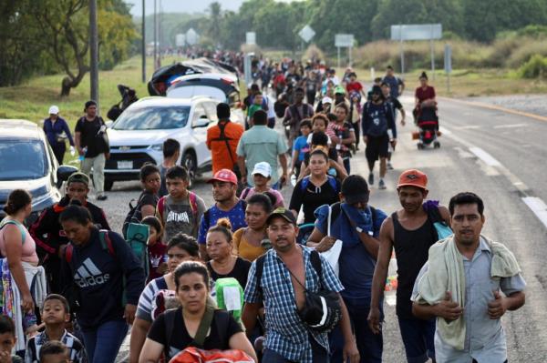 Migrants co<em></em>ntinue walking in a caravan in an attempt to reach the U.S. border, in Escuintla, Mexico December 28, 2023