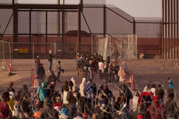 Asylum seekers wait to be processed