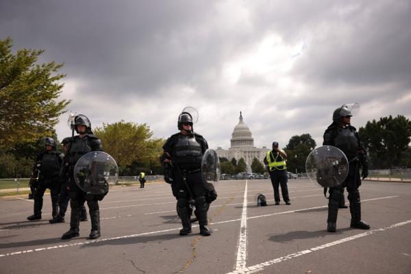 Police in riot gear outside of the Capitol building on Sept. 18, 2021. Recent protests have inspired some people to start prepping, according to the report.