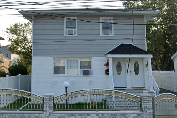 A photo of a house in Jamaica, Queens wher<em></em>e a 38-year-old man and a 35-year-old woman were found with gunshot wounds to the head