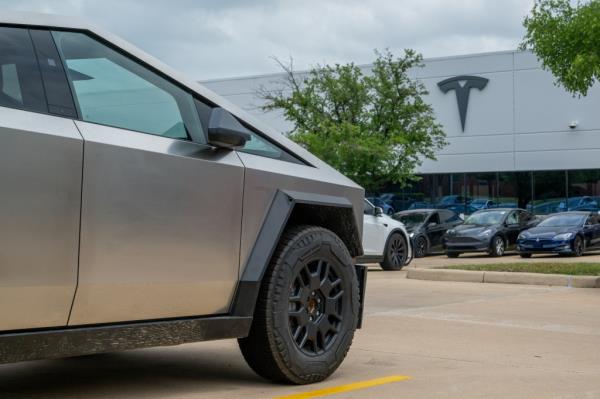 A Tesla Cybertruck parked at a Tesla dealership in Austin, Texas, amid news of workforce cuts and vehicle recalls