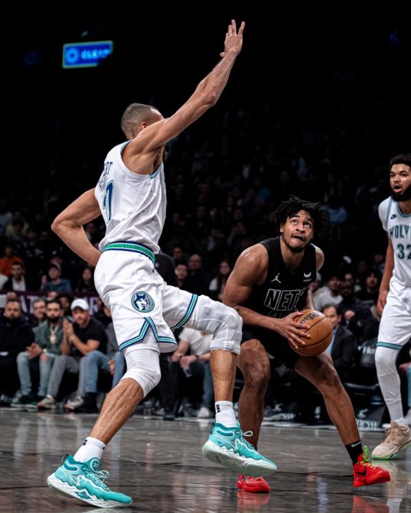 Brooklyn Nets guard Cam Thomas looks for a shot against Minnesota Timberwolves center Rudy Gobert 