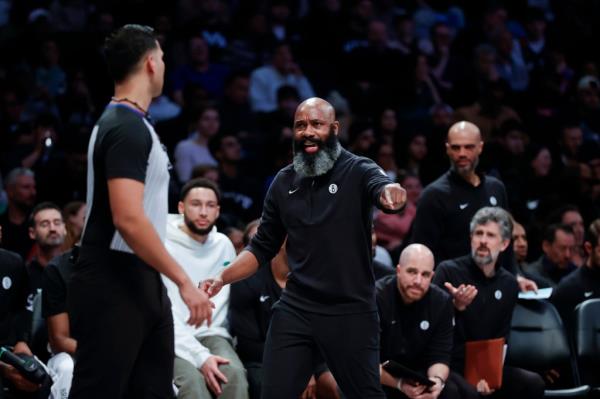 Brooklyn Nets head coach Jacque Vaughn (C) reacts to a call by one of the referees during his teams against the Minnesota Timberwolves in the second half at the Barclays Center in Brooklyn