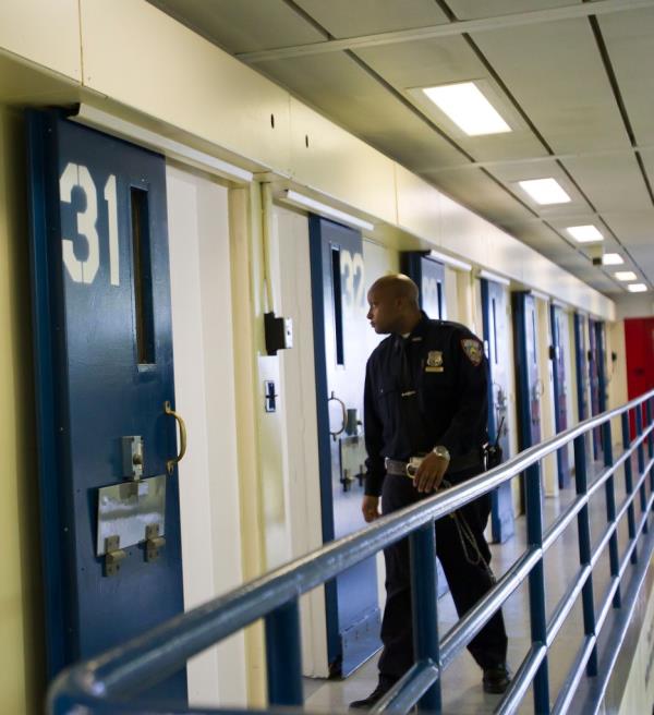 A New York Corrections officer walks inside the Enhanced Supervision Housing Unit 3 West (ESHU) at the Rikers Island Correctio<em></em>nal Facility during a media event Thursday, March 12, 2015