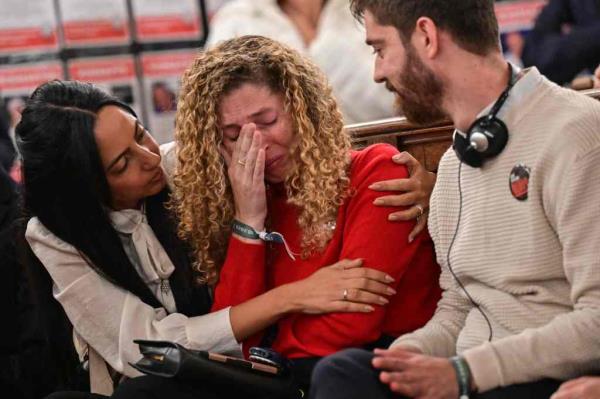 Adva Gutman, sister of a hostage of the rave party (C) reacts during an event held under the theme of 