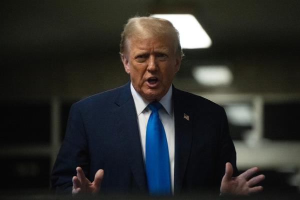 Former U.S. President Do<em></em>nald Trump speaks to the media at the end of the day at Manhattan Criminal Court during his trial for allegedly covering up hush mo<em></em>ney payments on April 22, 2024 in New York City.