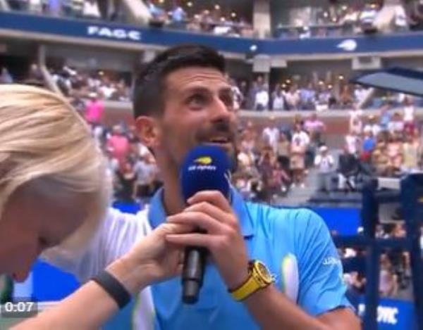 Novak Djokovic sings along with the fans at the U.S. Open on Tuesday.