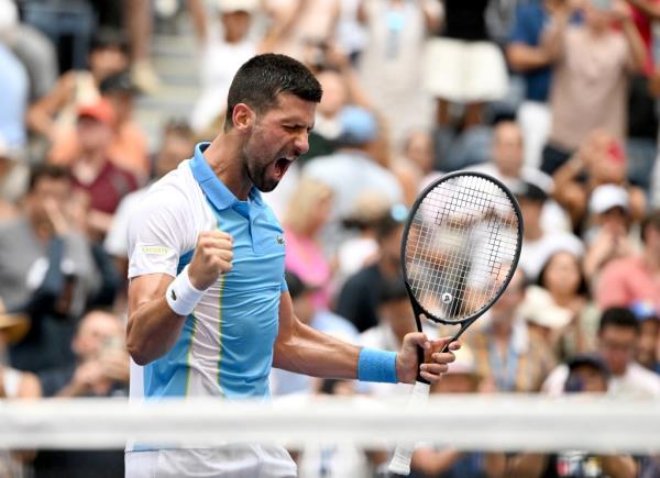 Novak Djokovic celebrates his win at the U.S. Open on Tuesday.