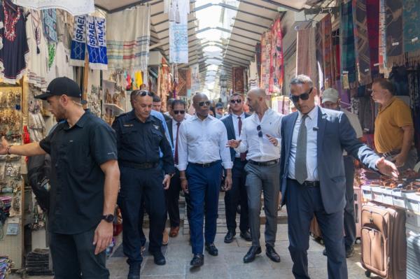 Mayor Eric Adams of New York, center, tours the Old City of Jerusalem, Tuesday, Aug. 22, 2023. Adams spent the second day of his visit to Israel touring holy sites before a planned meeting with Prime Minister Benjamin Netanyahu as he sought to avoid publicly weighing into the political crises plaguing the nation. (AP Photo/Ohad Zwigenberg)