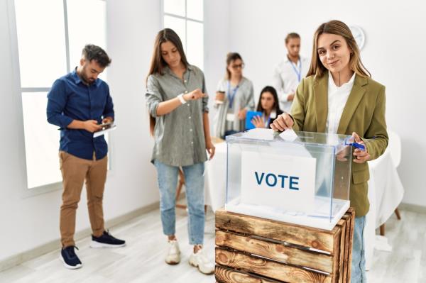 Young woman casting a ballot