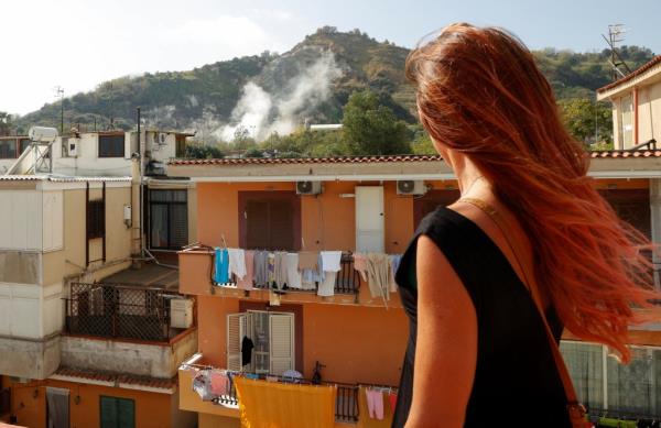 Stefania Briganti, a ballerina in Milan looks at the sulphuric fumes billowing from the Campi Flegrei volcanic region.