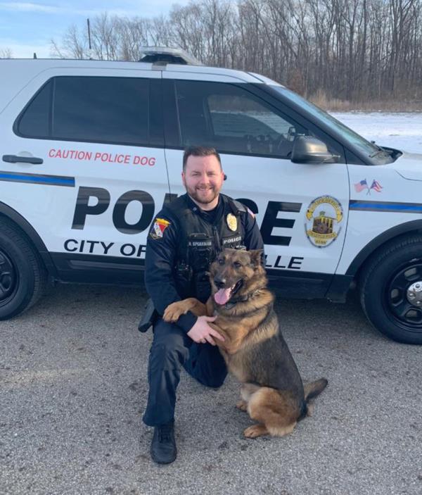 Officer Ryan Speakman and the dog.