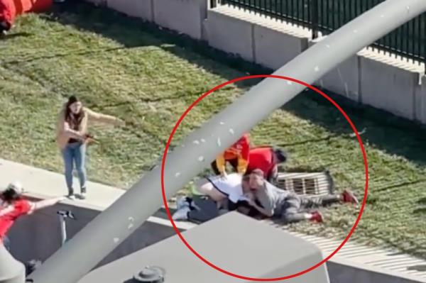 Screenshot of people tackling suspect