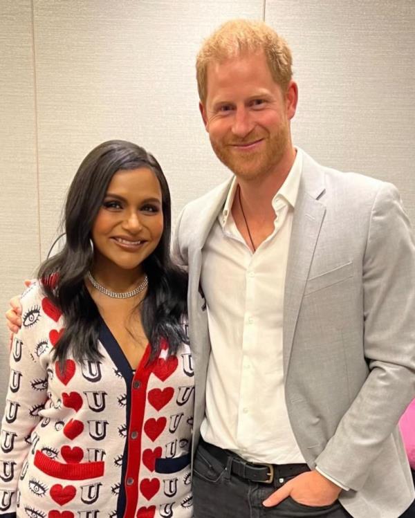 Mindy Kaling and Prince Harry posing for a photo with a jam jar from Meghan Markle