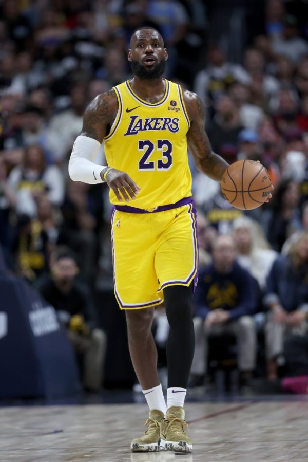 LeBron James #23 of the Los Angeles Lakers brings the ball down the court against the Denver Nuggets in the third quarter during game five of the Western Co<em></em>nference First Round Playoffs at Ball Arena on April 29, 2024 in Denver, Colorado. 