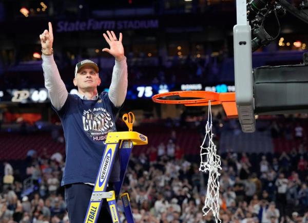 Co<em></em>nnecticut Huskies head coach Dan Hurley cuts the basketball net winning the Men's NCAA natio<em></em>nal champio<em></em>nship game against the Purdue Boilermakers at State Farm Stadium in Glendale on April 8, 2024.