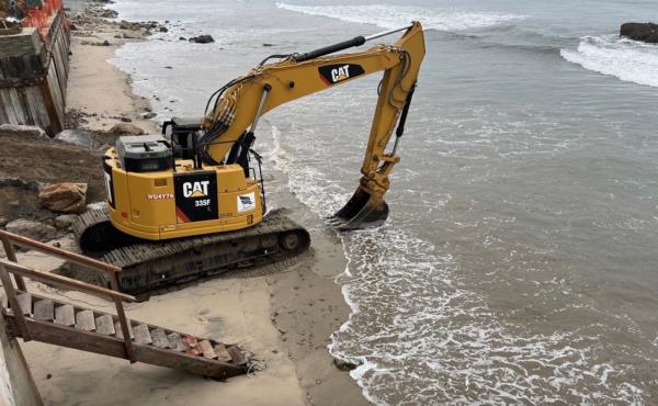 Excavators on the beach