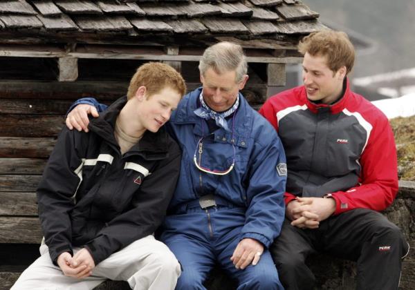 Prince Charles, Prince William, and Prince Harry posing together during a ski holiday in Klosters, Switzerland in 2005