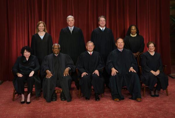 The Supreme Court from left, Justices So<em></em>nia Sotomayor, Amy Co<em></em>ney Barrett, Clarence Thomas and Neil Gorsuch, Chief Justice John Roberts, and Justices Brett Kavanaugh, Samuel Alito, Ketanji Brown Jackson and Elena Kagan.