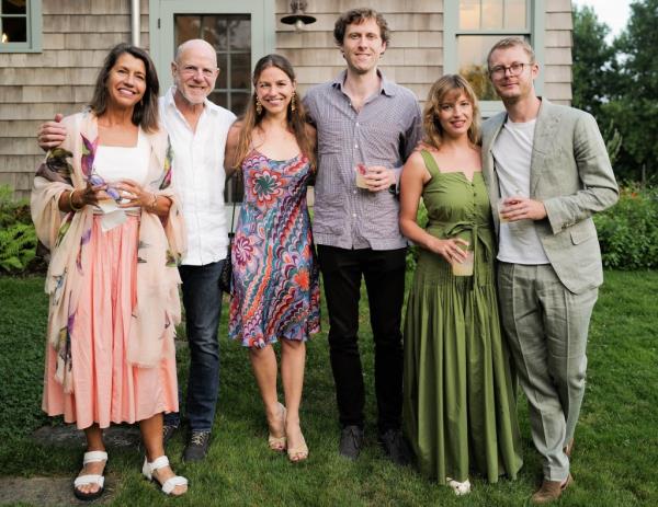 The McGowan family seen here at a summer party in the Hamptons, as reported by the DailyMail.