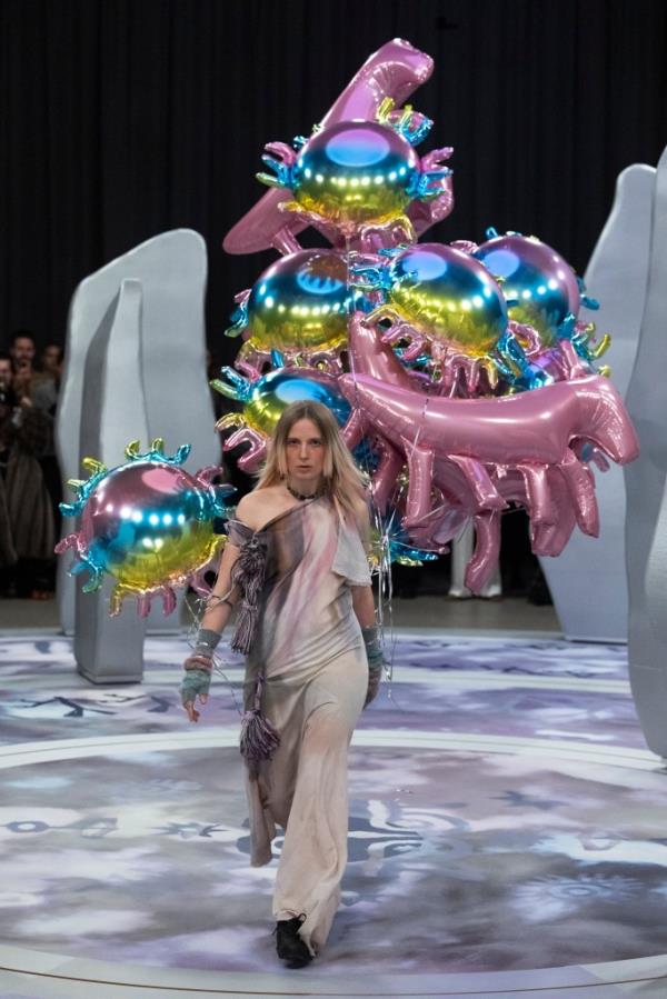 A model walks the runway, wearing a dress with balloons in Copenhagen Fashion Week AW24 during the Paolina Russo show.