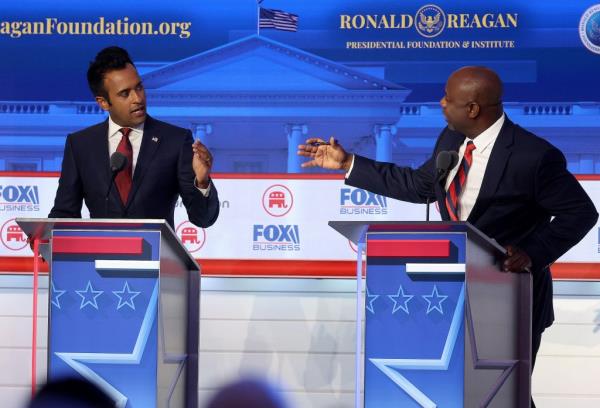 Republican presidential candidates (L-R), Vivek Ramaswamy and U.S. Sen. Tim Scott (R-SC) participate in the FOX Business Republican Primary Debate at the Ro<em></em>nald Reagan Presidential Library on September 27, 2023 in Simi Valley, California. 