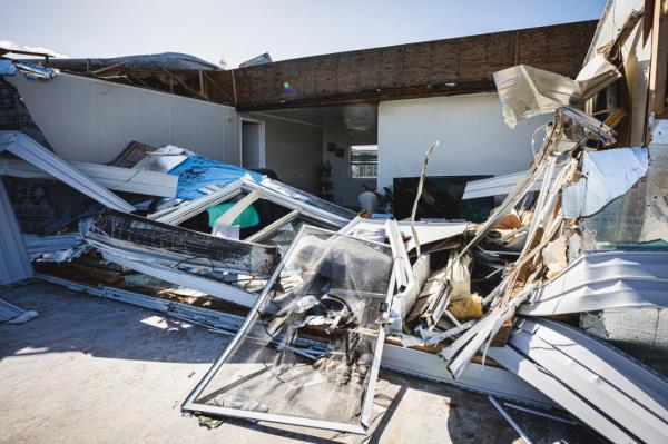 A damaged home in the Tropical Harbor Estates mobile home park sits in need of repairs.